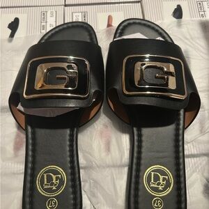 Black Slide Sandals with Gold 'G' Buckle Accent